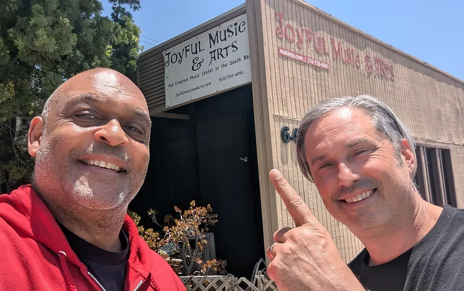 Makinto and Garth outside Joyful Music & Arts